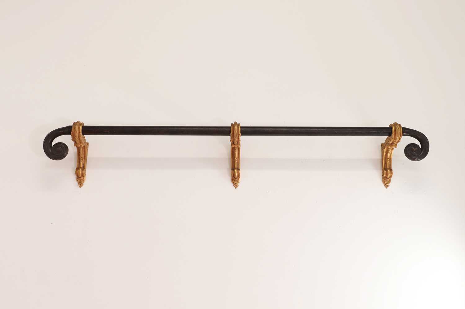 Lot 541 A bronze curtain pole and three gilt