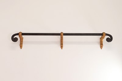 Lot 541 - A bronze curtain pole and three gilt brackets