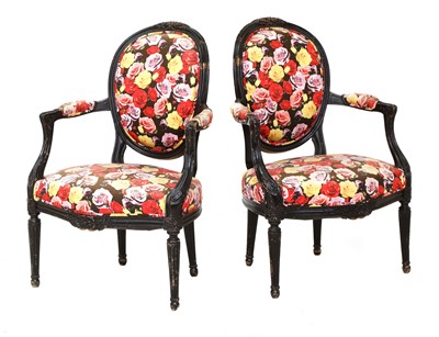 Lot 360 - A pair of ebonised armchairs