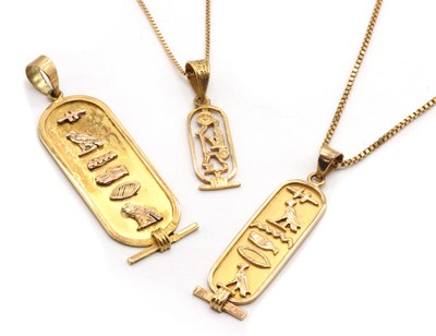 Lot 428 - Three Egyptian gold cartouche pendants