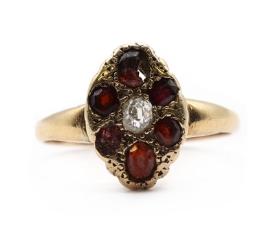 Lot 170 - A gold diamond and garnet cluster ring