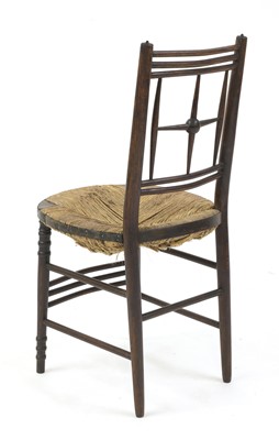 Lot 28 - An ebonised Arts and Crafts ash side chair