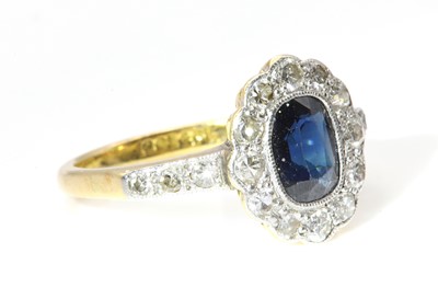 Lot 178 - A sapphire and diamond oval cluster ring, c.1930