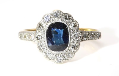 Lot 178 - A sapphire and diamond oval cluster ring, c.1930