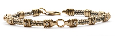 Lot 113 - A 9ct two colour gold diamond set bracelet