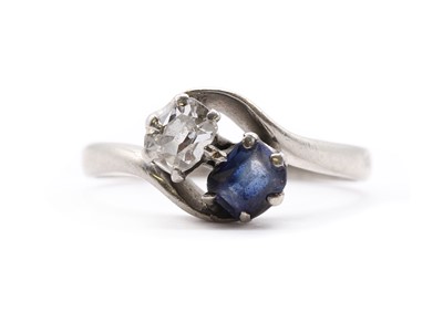 Lot 265 - A two stone diamond and sapphire crossover ring