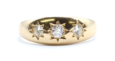 Lot 12 - An 18ct gold three stone diamond ring
