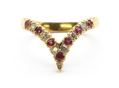 Lot 91 - An 18ct gold ruby and diamond wishbone half eternity ring