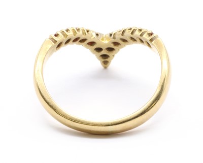 Lot 91 - An 18ct gold ruby and diamond wishbone half eternity ring