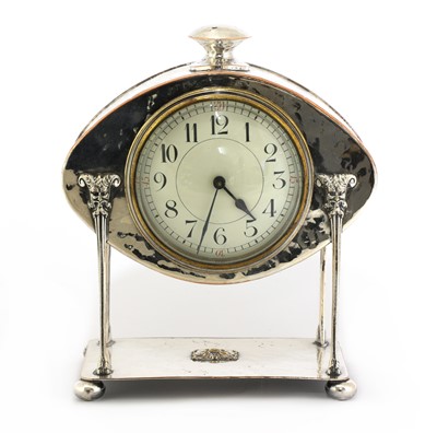 Lot 24 - An Arts and Crafts silver-plated desk clock
