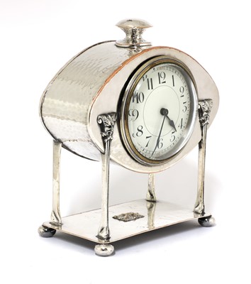 Lot 24 - An Arts and Crafts silver-plated desk clock