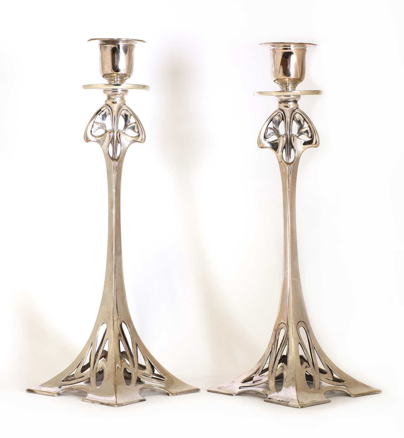 Lot 19 - A pair of WMF silver-plated candlesticks