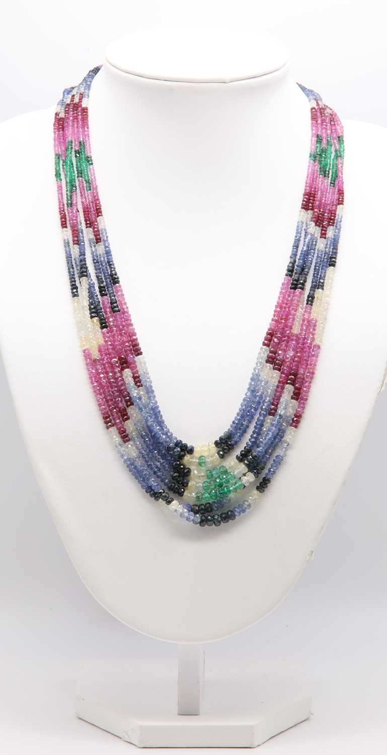 Lot 349 - A seven row graduated faceted sapphire, ruby and emerald bead necklace