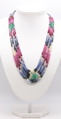 Lot 349 - A seven row graduated faceted sapphire, ruby and emerald bead necklace