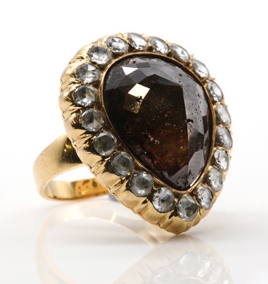 Lot 477 - A fancy brown diamond pear shaped cluster ring