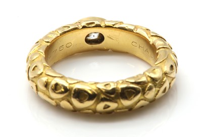 Lot 524 - A Chaumet diamond set band ring