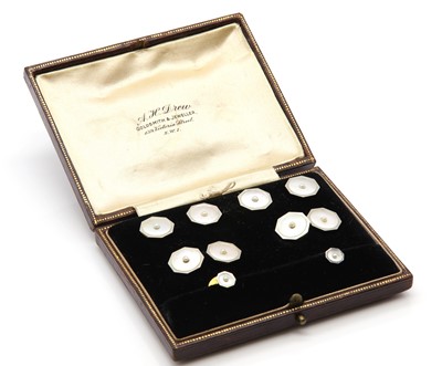 Lot 183 - A cased Art Deco mother-of-pearl and seed pearl dress stud set