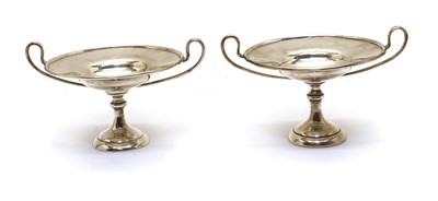 Lot 24 - A pair of silver twin handled bon bon dishes