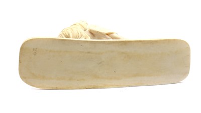 Lot 133 - A Japanese ivory okimono