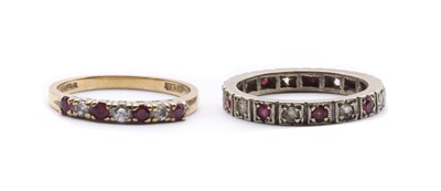 Lot 382 - A 9ct gold ruby and diamond half eternity ring