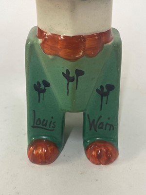 Lot 106 - A Louis Wain pottery model of 'Lucky Haw-Waw', a futurist cat