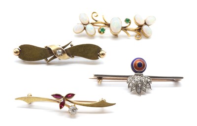 Lot 373 - Four gold brooches