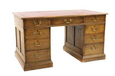 Lot 389 - A George III style oak pedestal desk