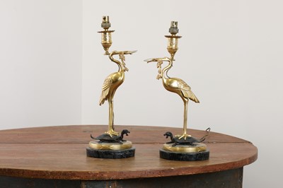Lot 5 - A pair of gilt and patinated bronze table lamps