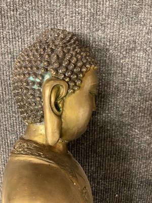Lot 65 - A pair of Chinese brass Buddha