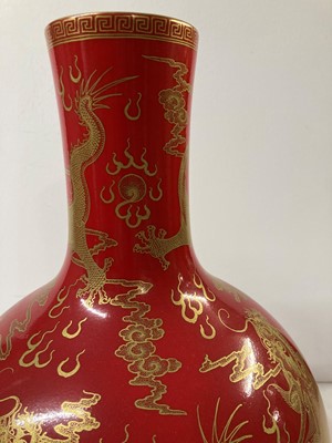 Lot 133 - A pair of Chinese red-glazed tianqiuping