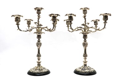 Lot 55 - A pair of silver plated four branch candelabra