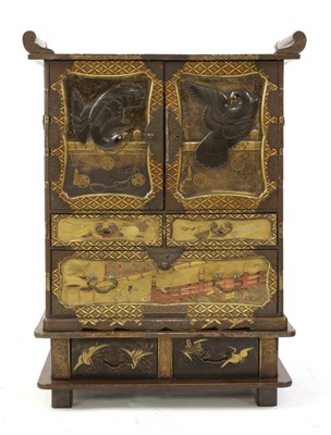 Lot 204 - A Japanese gilt-lacquered cabinet