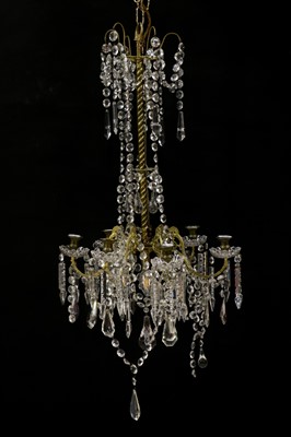 Lot 397 - A brass six light chandelier