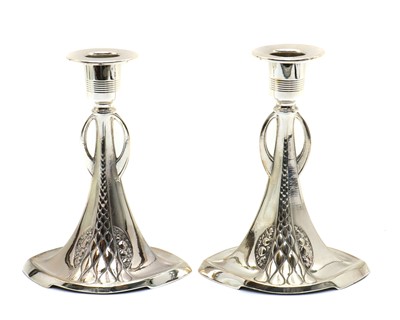 Lot 16 - A pair of WMF silver-plated candlesticks