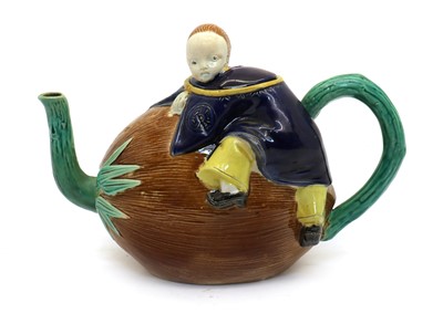 Lot 163 - A Majolica teapot and cover
