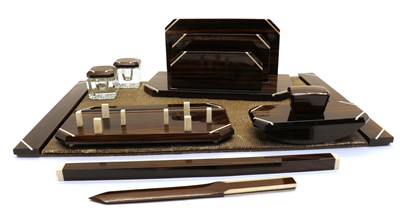 Lot 324 - An Art Deco Macassar and ivory mounted seven piece desk set