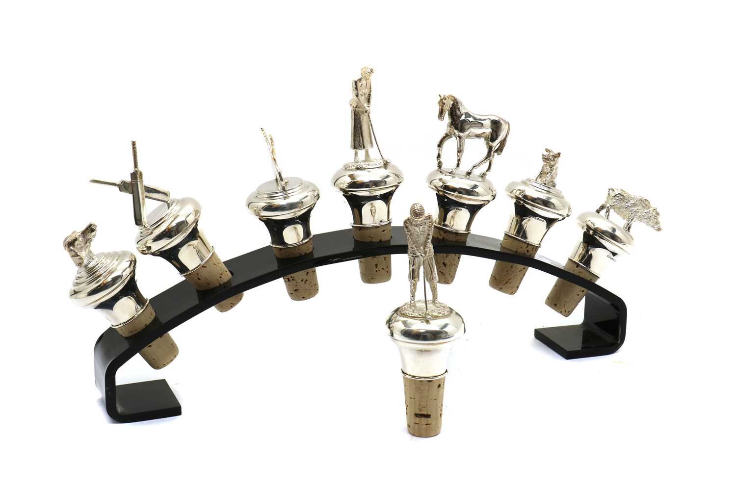 Lot 26 - A group of eight modern silver novelty bottle stoppers