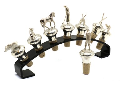 Lot 26 - A group of eight modern silver novelty bottle stoppers