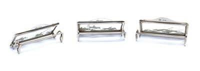 Lot 9 - A set of three silver menu holders