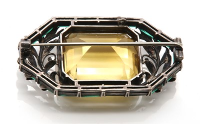 Lot 146 - An Arts & Crafts silver citrine and paste brooch, attributed to Bernard Instone