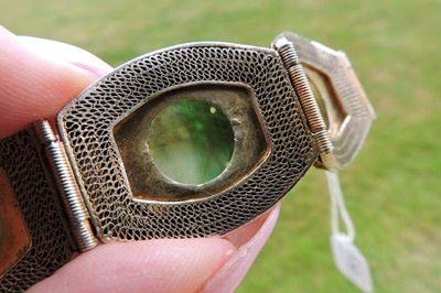 Lot 130 - A Chinese silver gilt filigree, jade and enamel bracelet.