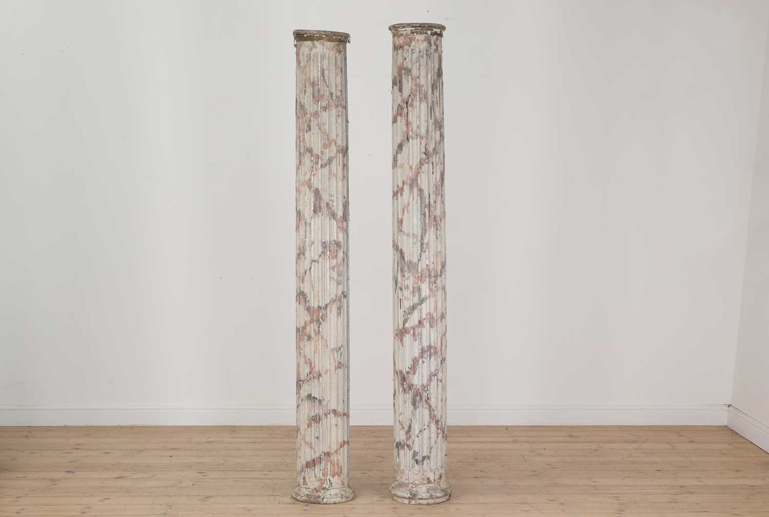Lot 414 - A pair of painted pine and faux marble fluted columns