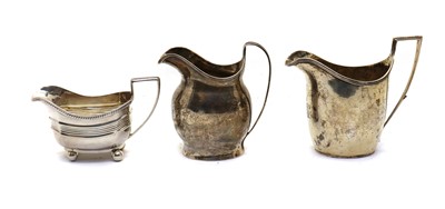 Lot 52 - A group of three silver cream jugs
