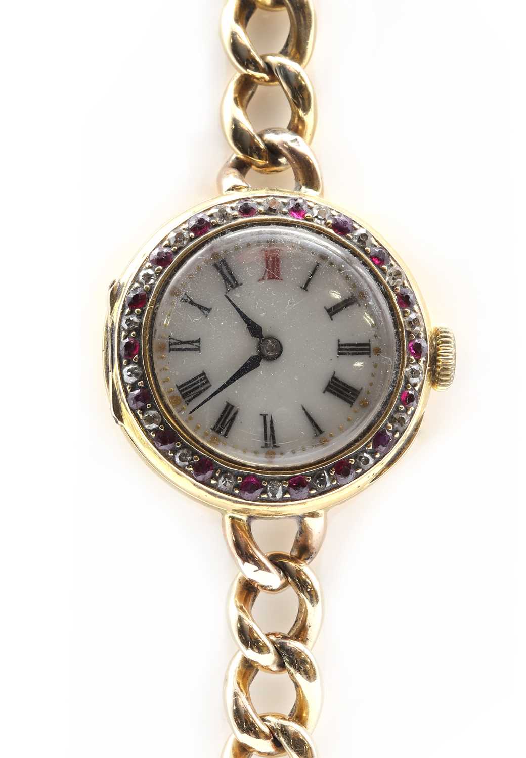 Lot 490 - A ladies' gold ruby and diamond set mechanical bracelet watch