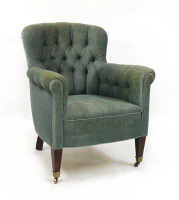 Lot 398 - A barrel back armchair