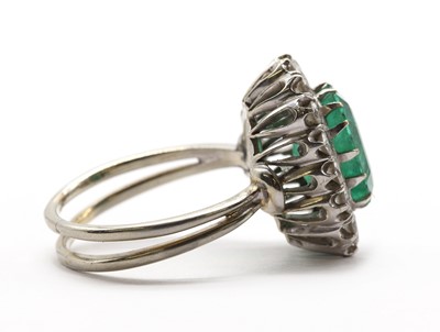 Lot A white gold emerald and diamond cluster ring