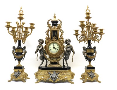 Lot 244 - A Louis XV style clock garniture