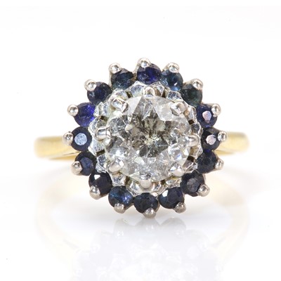 Lot 282 - A diamond and sapphire circular cluster ring