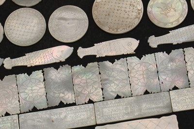 Lot 103 - A quantity of Chinese engraved mother of pearl gaming counters