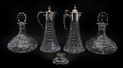 Lot 17A - A near pair of silver topped cut glass claret jugs